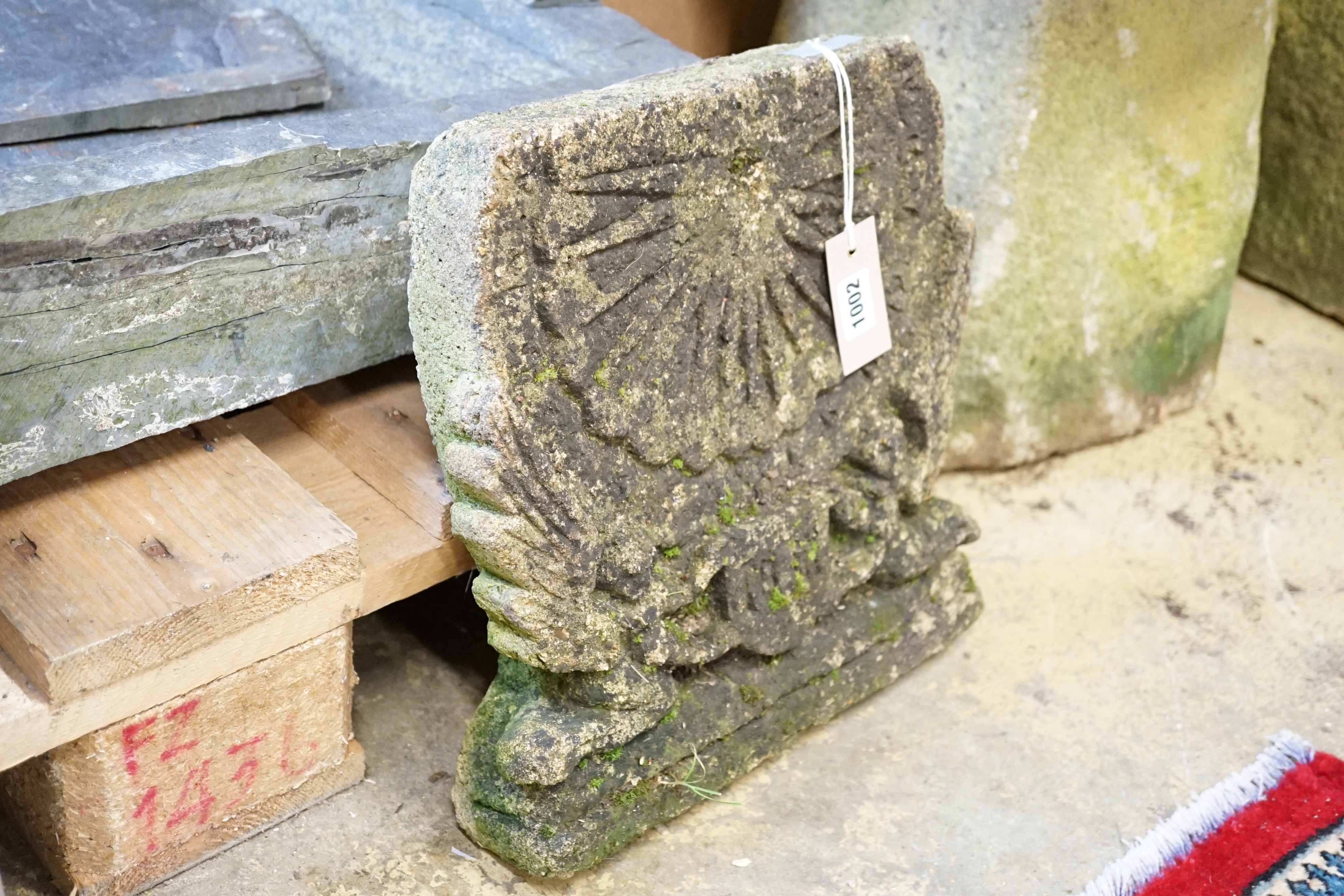A reconstituted stone vertical sundial, height 33cm, width 32cm